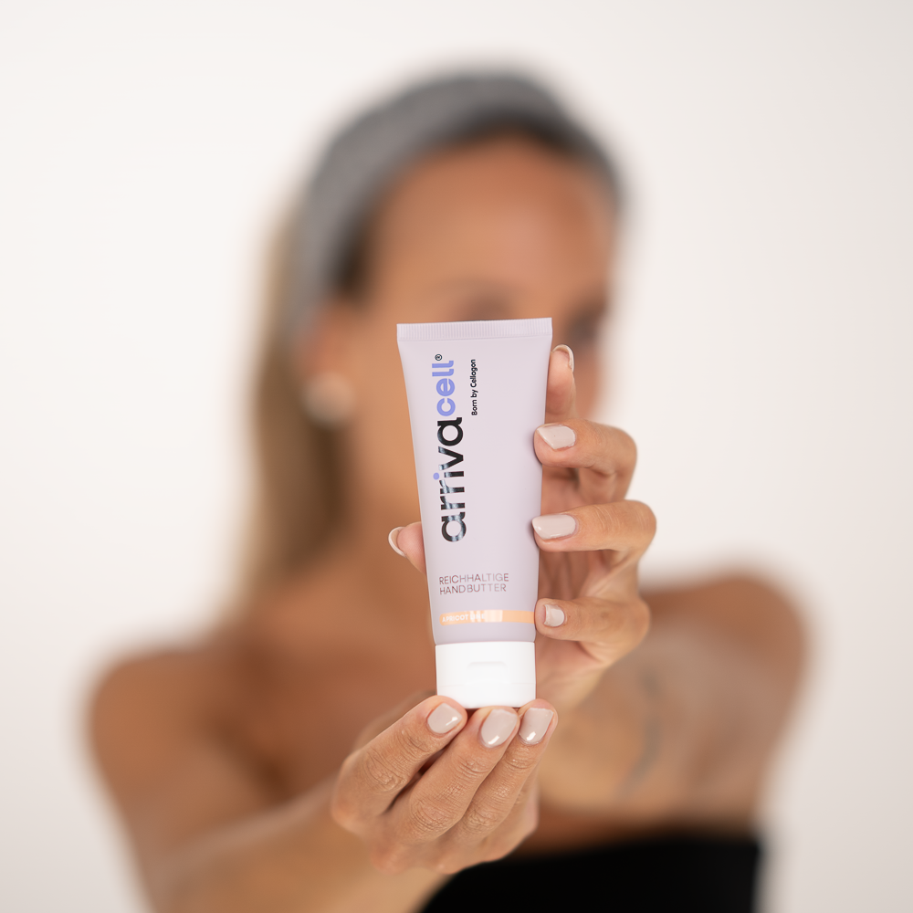 girl holding arrivacell handbutter in her hand
