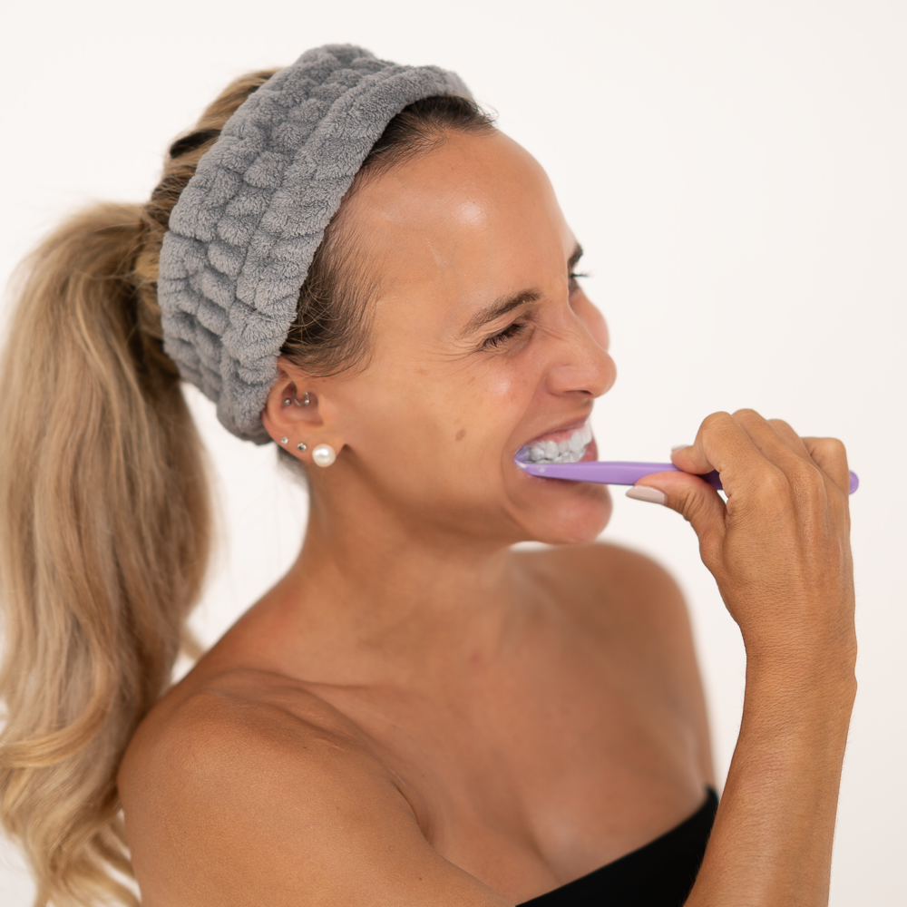 girl brushing her teeth