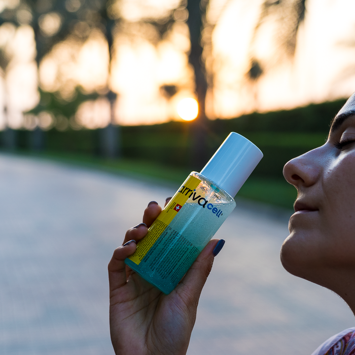 gril posing in sunset with after sun spray