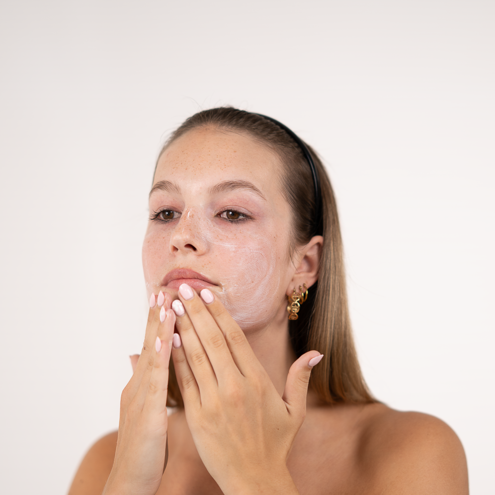 girl with sun cream on her face