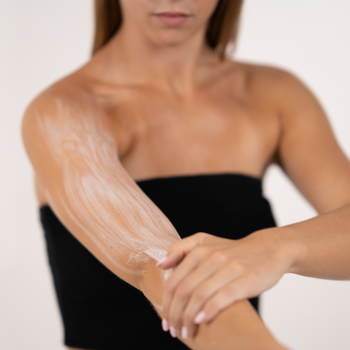 body lotion summer skin in use on a girls arm